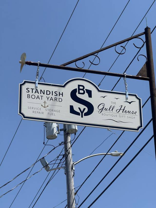 The roadside sign for Standish Boat Yard and The Gull House boutique gift shop