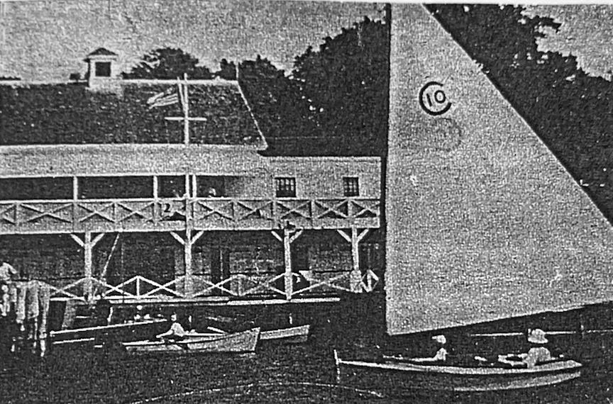 The building's porch with crossed railings as a candy boat sails past